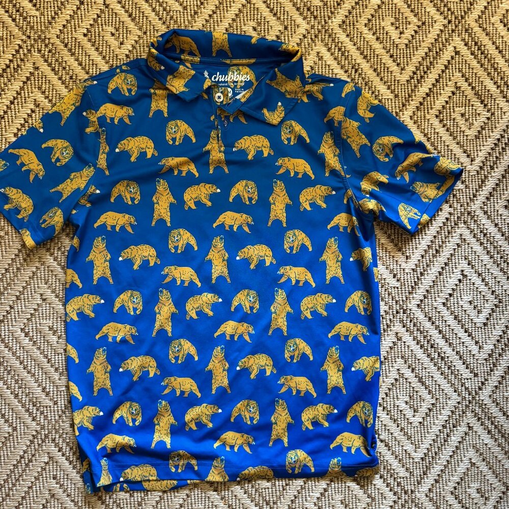 Youth medium Chubbies performance polo shirt with blue background and bear print